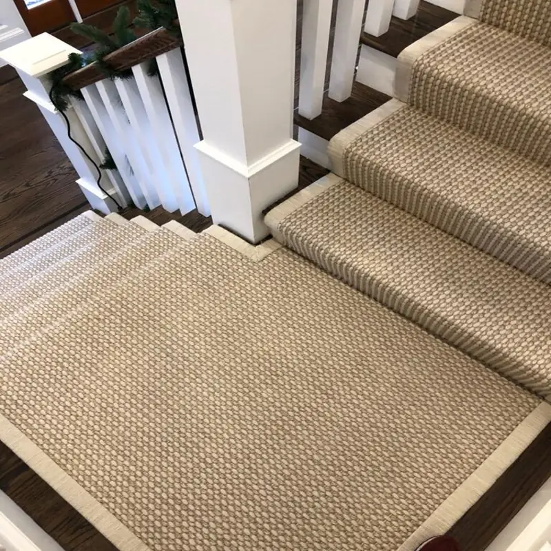 High-angle view of a textured loop sisal carpet stair runner